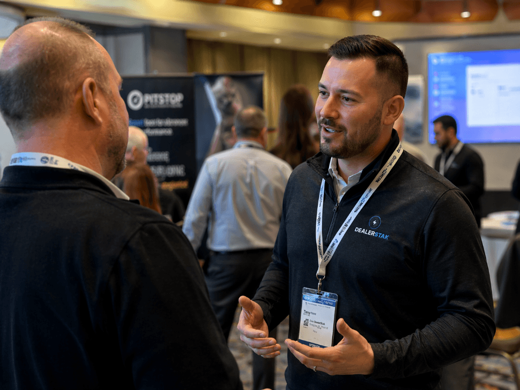 DealerStak team talking with a dealer at the 2025 Western Canadian Dealer Summit